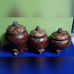 Set of Three Decorative Brown Lidded Canisters